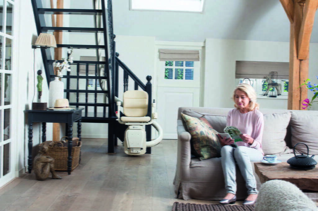 Home 28 Handicare woman reading stairlift HR